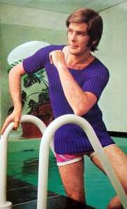Man in Purple Sweater getting out of pool.